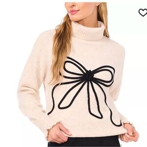 CeCe Cream Turtleneck Sweater with Black Bow Accent. Soft knit. Size Large